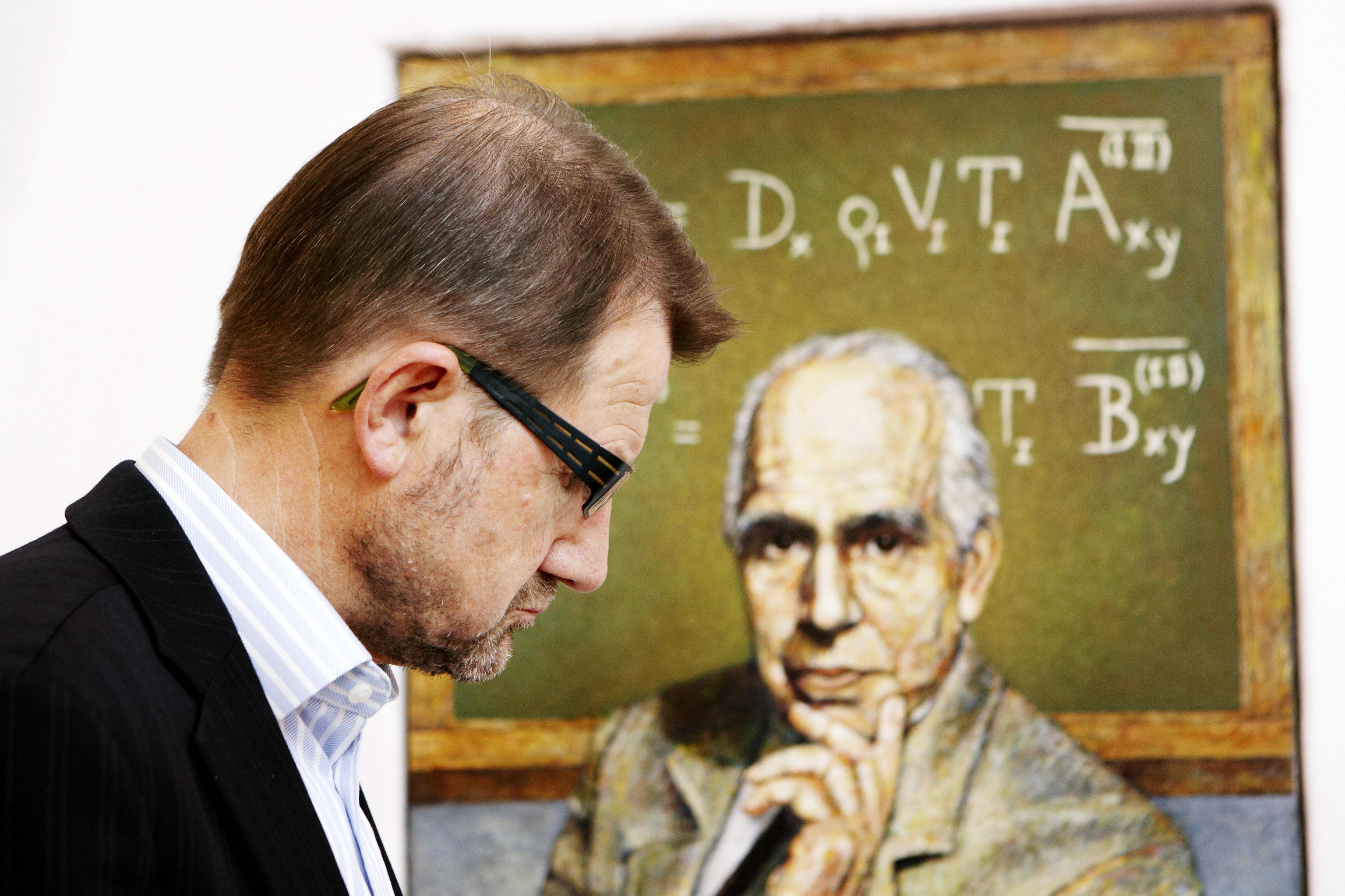 Helge Sander, Danish Minister of Science, Technology and Innovation (here in front of a painting of Niels Bohr), plans to allow private universities in Denmark.  Students and opposition politicians are astounded at the proposal