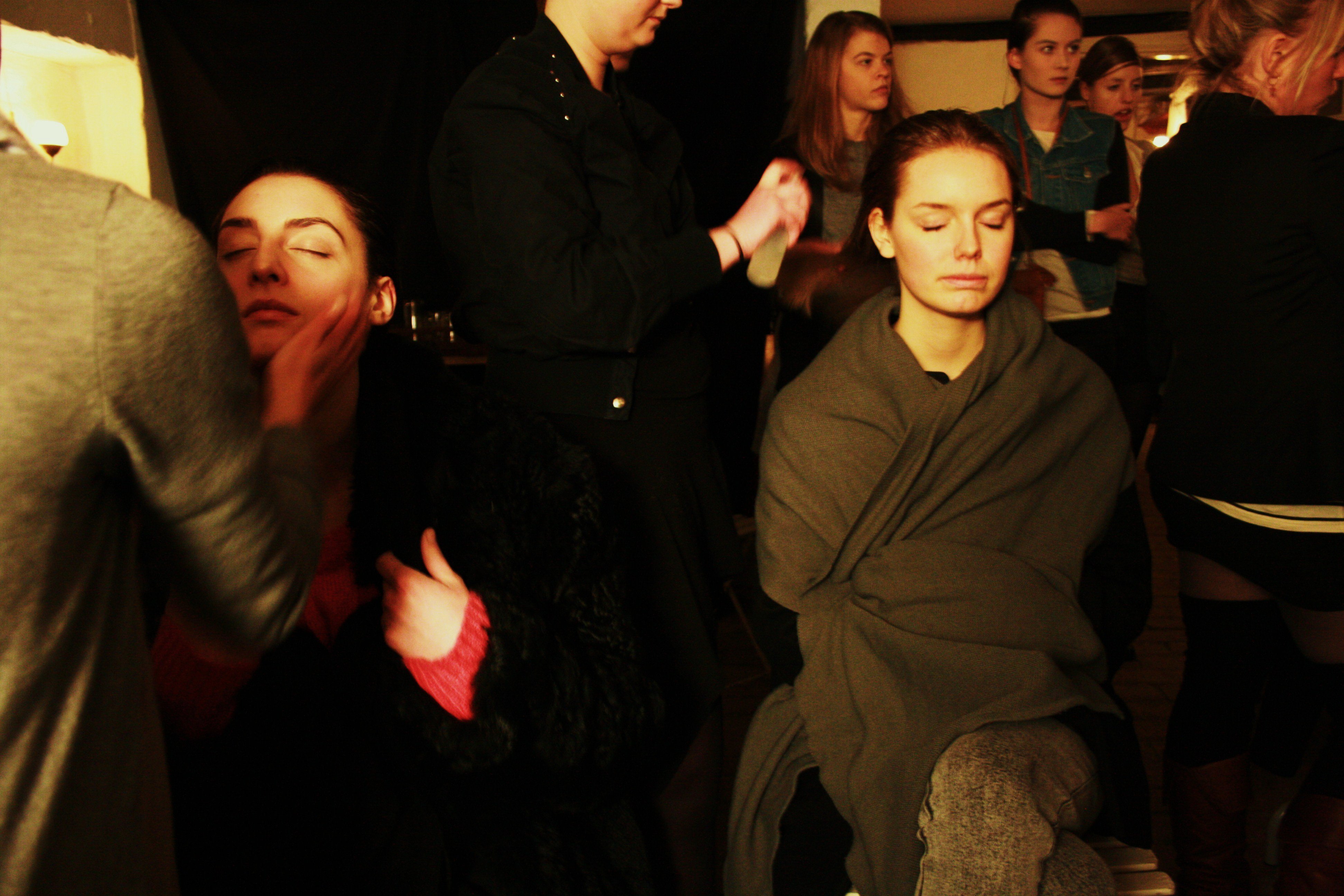 Models prepare to walk the runway backstage at the Silver.Spoon fashion week event