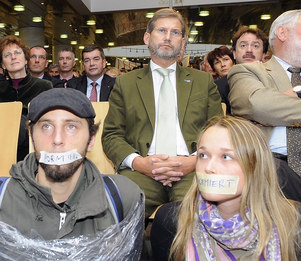 Former Minister of Science Johannes Hahn, (centre) keeps a straight face to student protest
