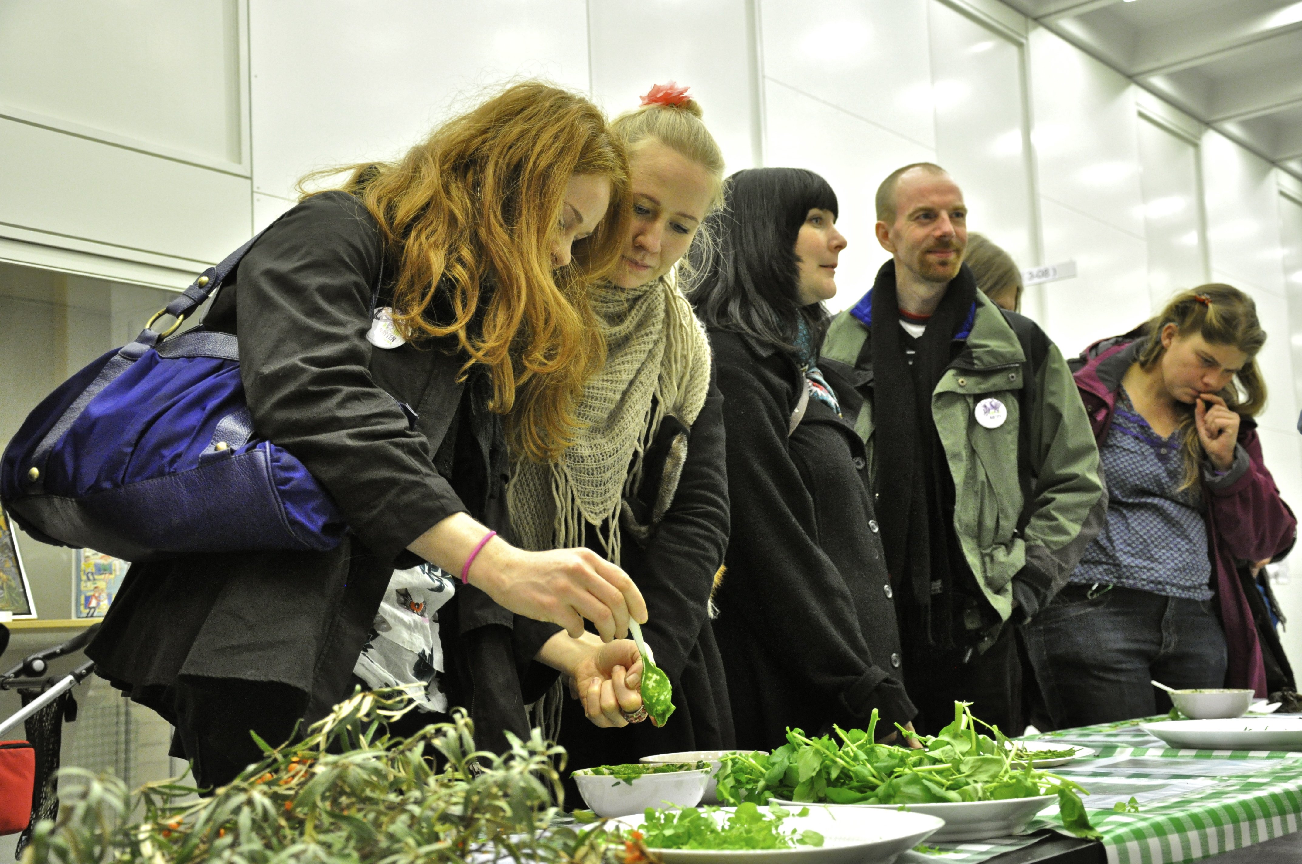 Passers-by taste wild harvested greens at the Faculty of Life Science