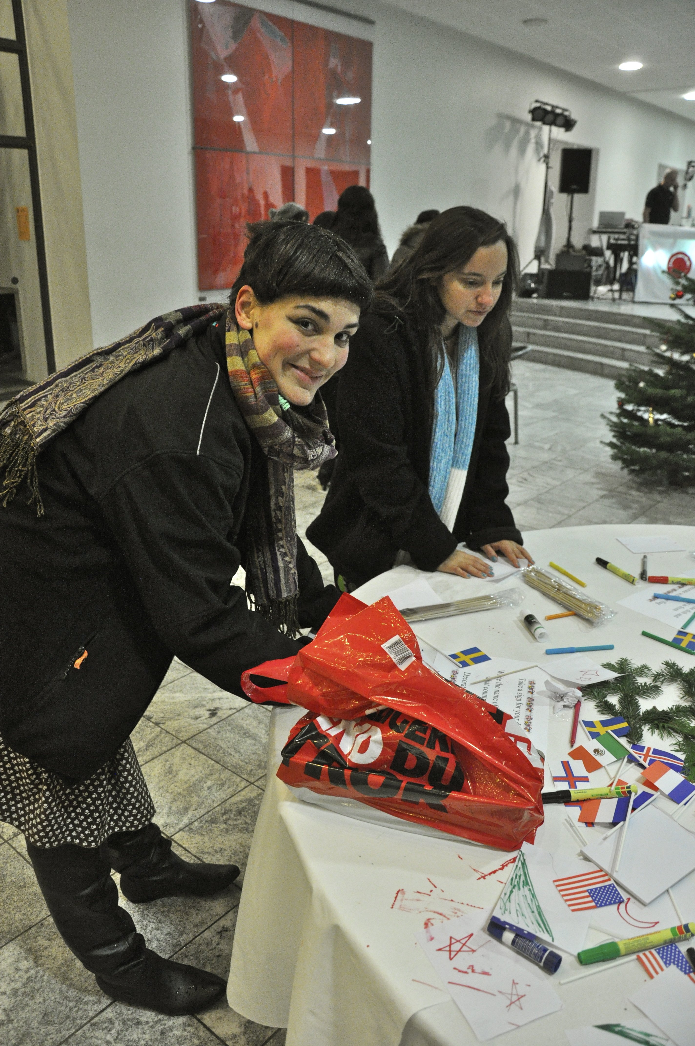 International students prepare national flags to mark the origins of their dish 