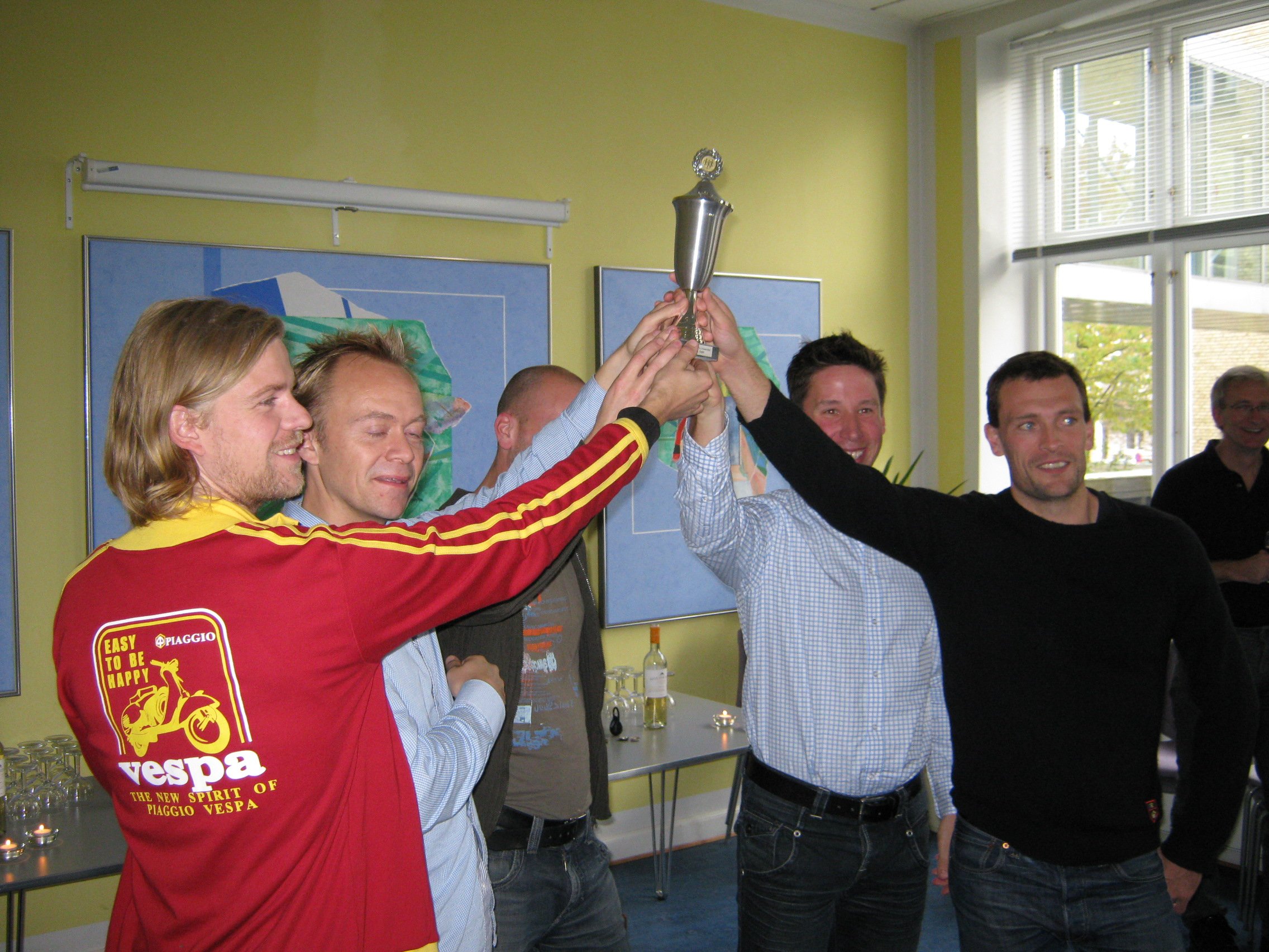 Celebrations all round, as the DHL team raise their prize