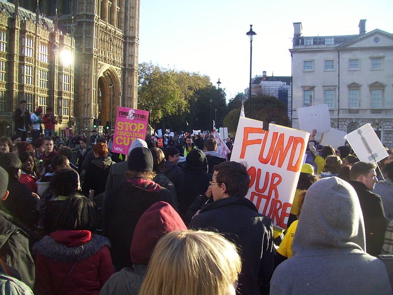 Student demonstrators marching past the London Houses of Parliament, before the protest turned violent