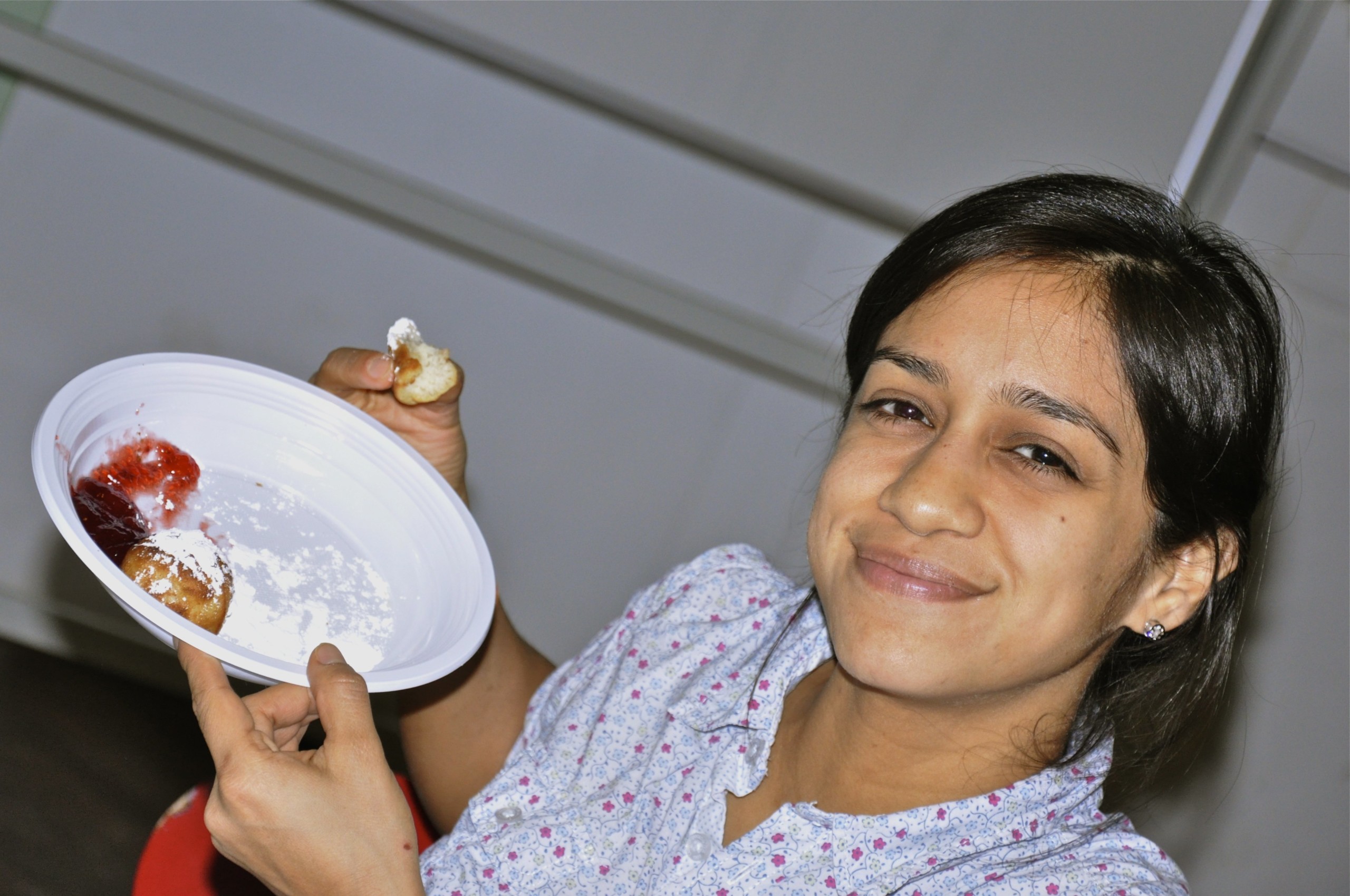 Ecuadorian student, Natalia Daqui, stuffs herself with æbleskiver. You can have æbleskiver as well in Tivoli at christmas time.