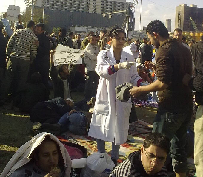 In one incident, violence turned into fighting talk, and then miraculously, a truce. Medics attend the wounded in embattled Cairo