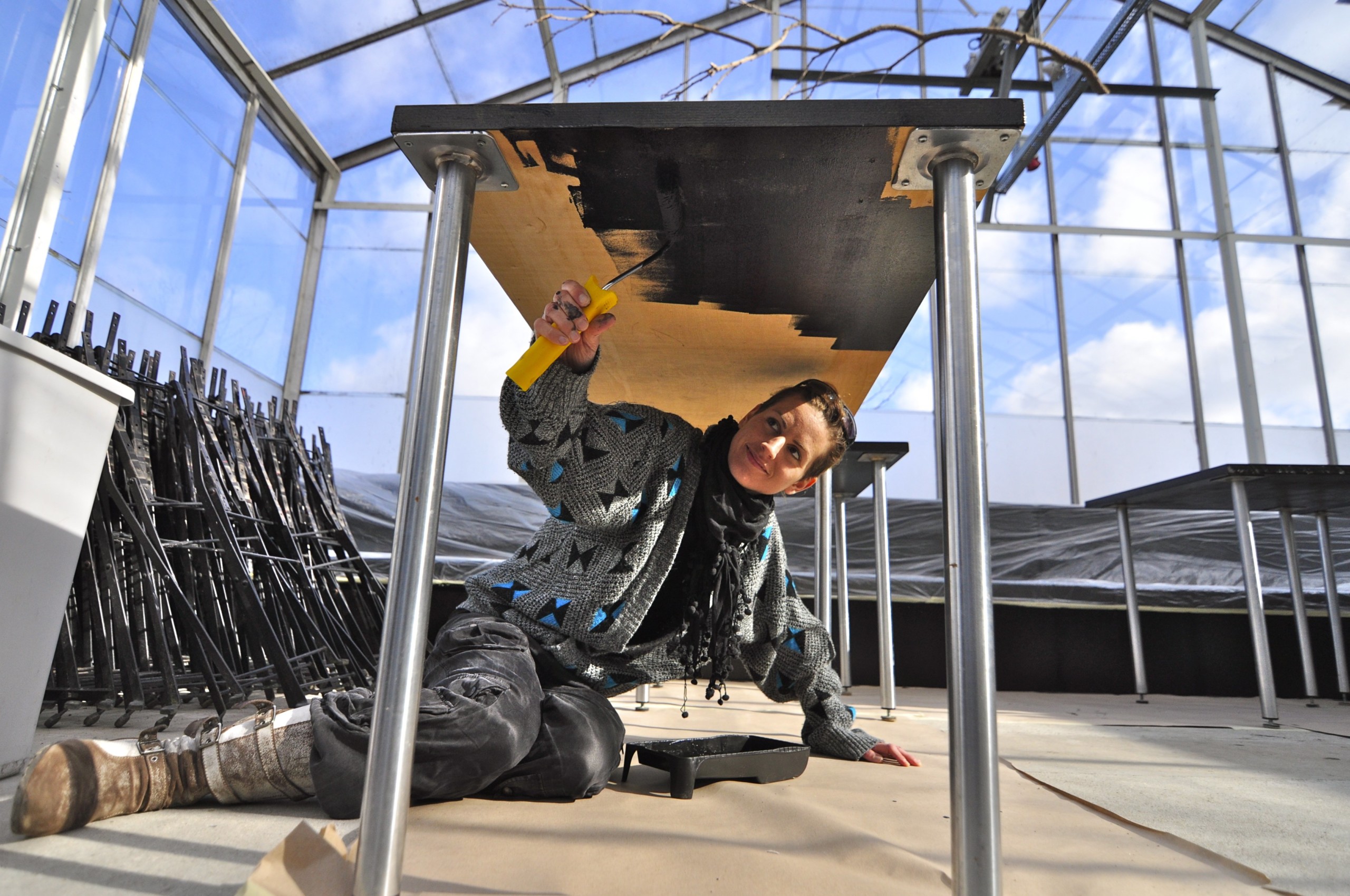 Architect, Michaela Weisskirchner-Barfod, applies a new coat of fresh, black paint