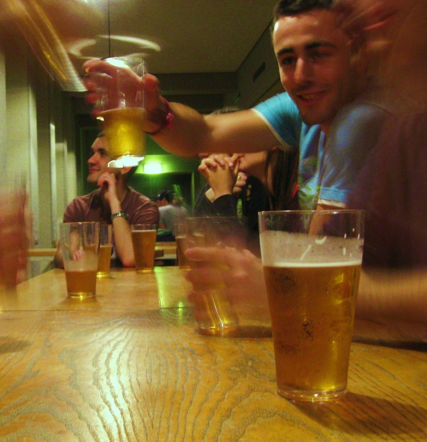 International students in Copenhagen raise their glass, and raise it again, and again…
