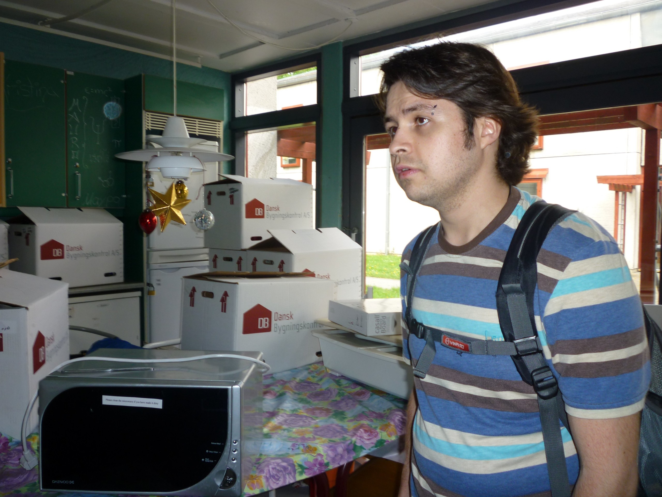 Carlos Diaz shows where renovators have left residents' belongings in boxes