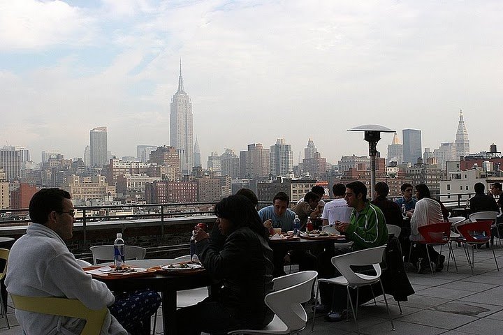 Googlers enjoy lunch outside from their balcony in New York