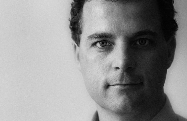 Election campaign photo of new minister for research and innovation etc. He is now at the centre of things