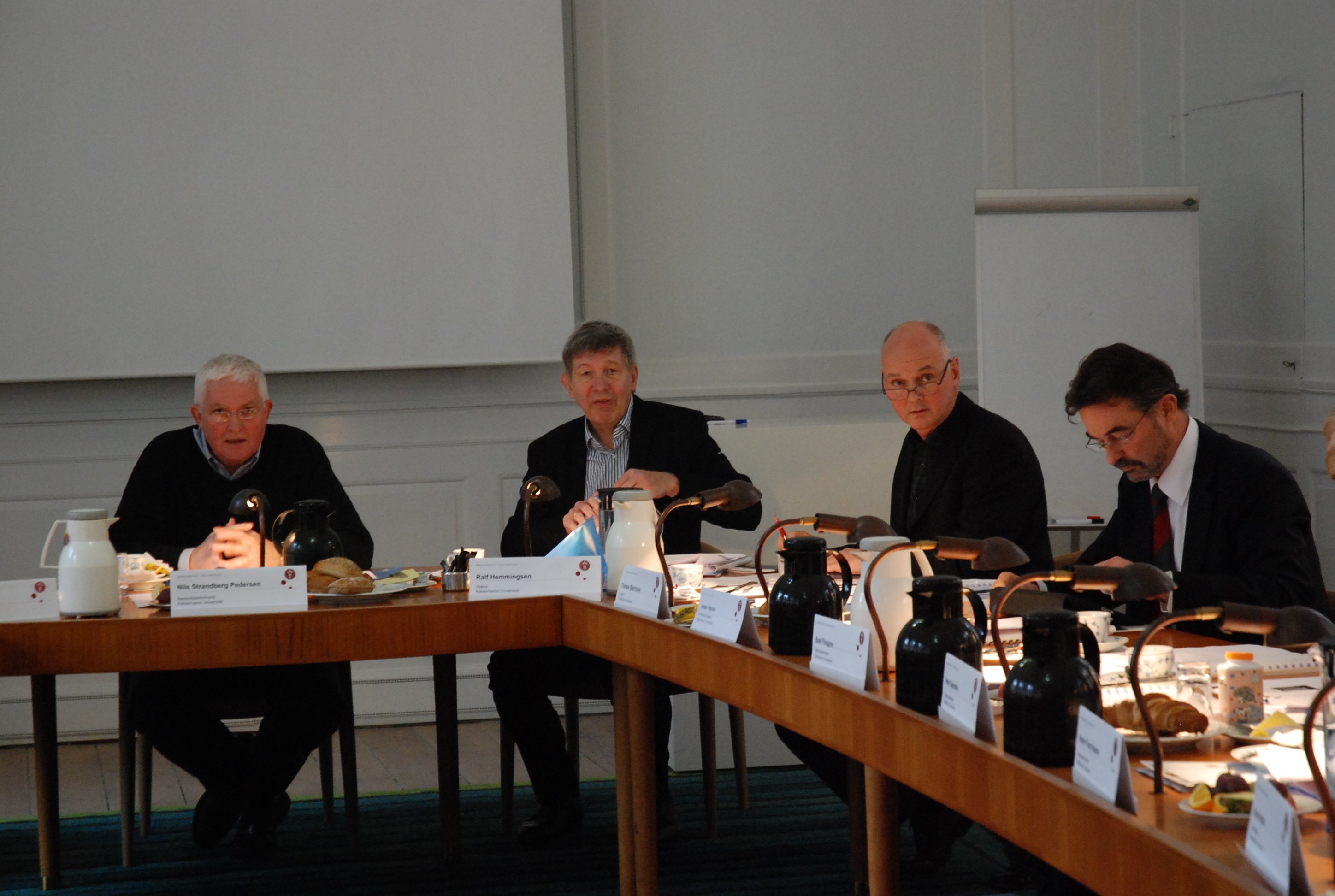 Top management at a Board meeting of the University. Staff and student reps criticise the management version of the Department Councils