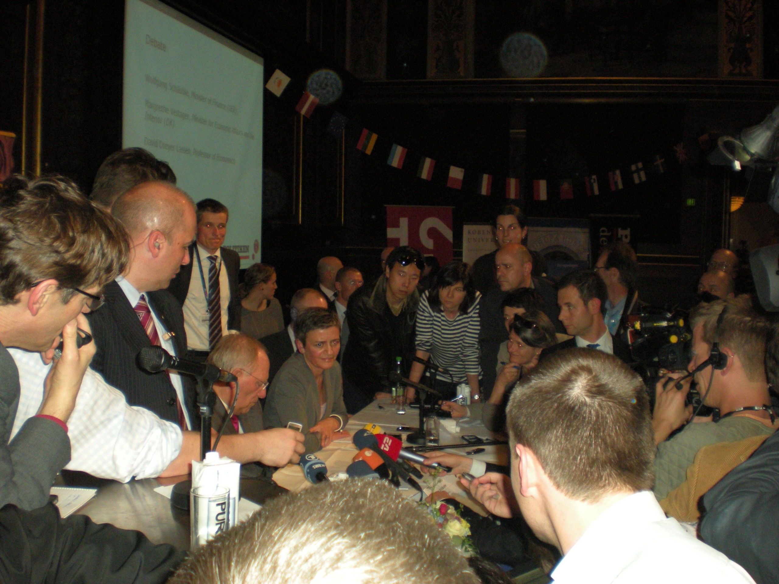 German finance minister Wolfgang Schäuble, (left) and Danish economy minister Margrether Vestager (right) mobbed by journalists Thursday night