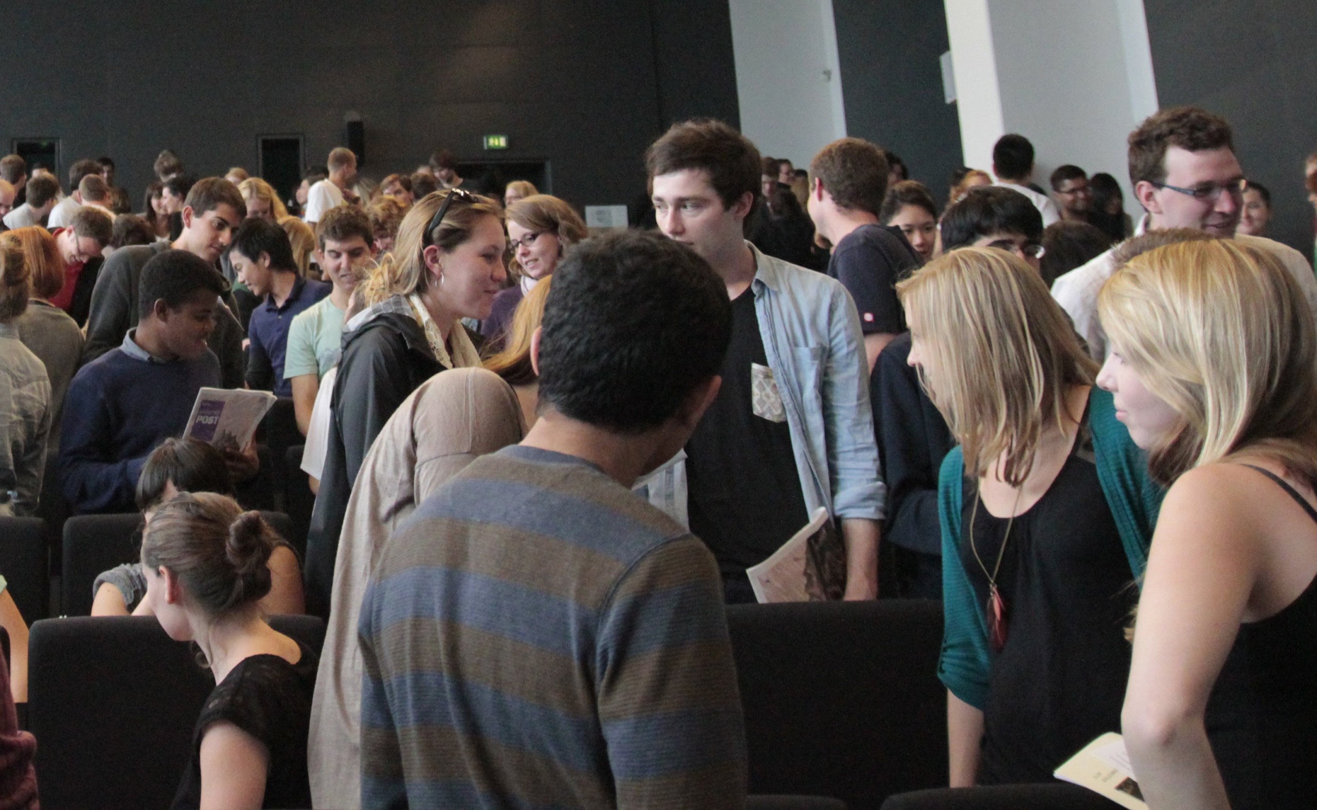 New students at an orientation meeting in August 2012. There are slightly more empty seats in this auditorium this year