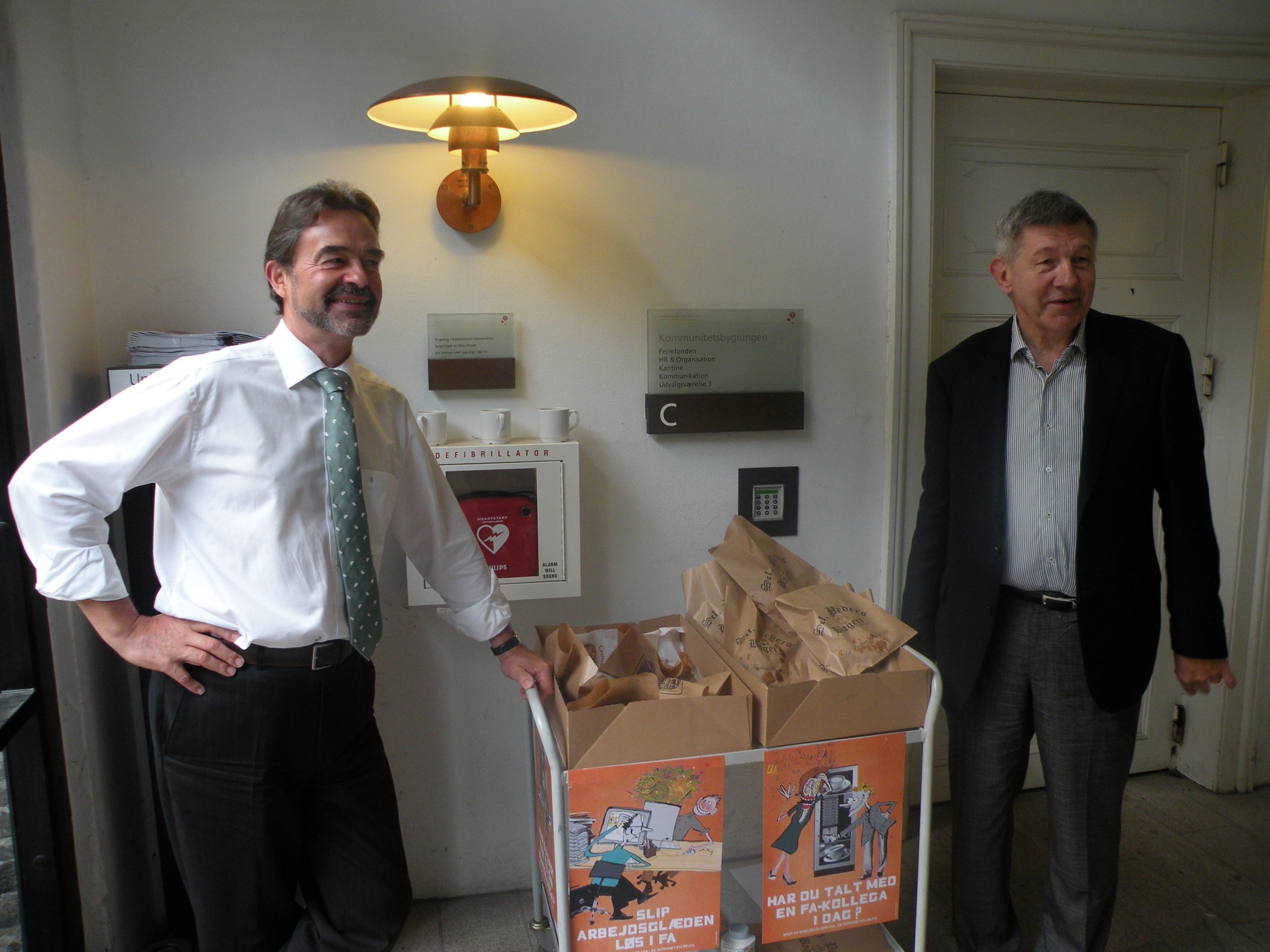 The university director Jørgen Honoré (left) and Rector Ralf Hemmingsen (right) guard their precious stack of croissants