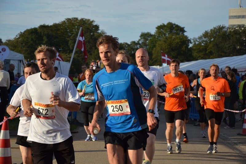 High energy physicist Kim Splittorff (right) 'thoroughly enjoyed himself' on his 25 kilometre slog through the thousands of other runners, he says