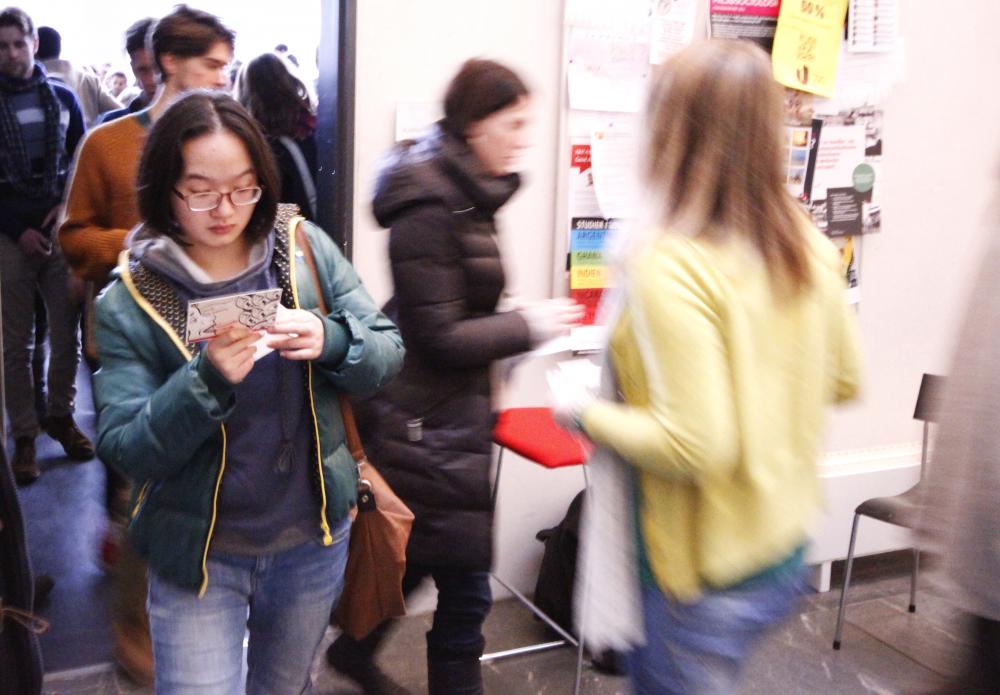 Coming in and out of the door to the auditorium, new students had to zig-zag past organisations proffering cards and sign-up slips