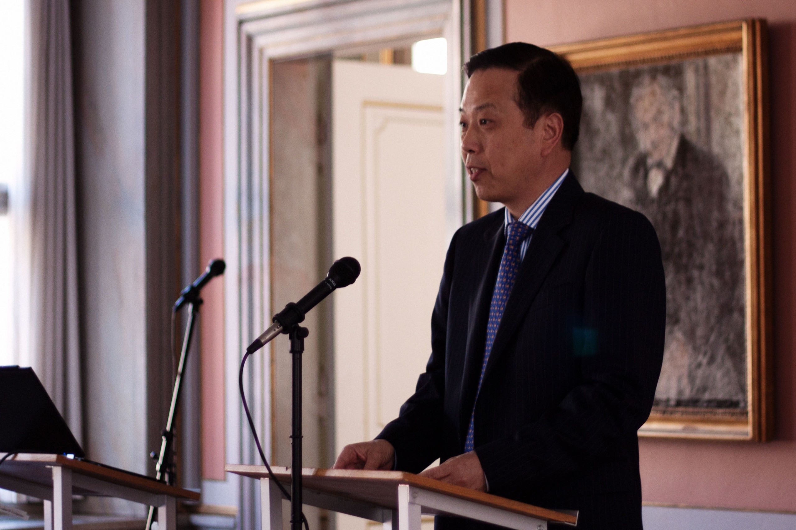 Chinese ambassador Li Ruiyu takes the podium at the Fudan centre opening event