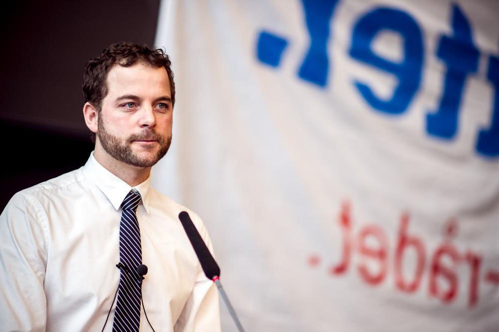Morten Østergaard when he presented his proposal for the SU reform at the University of Copenhagen amid protests. Now a deal has been made with opposition parties. Good news for non-Danish nationals employed in Denmark (Image flipped horizontal)