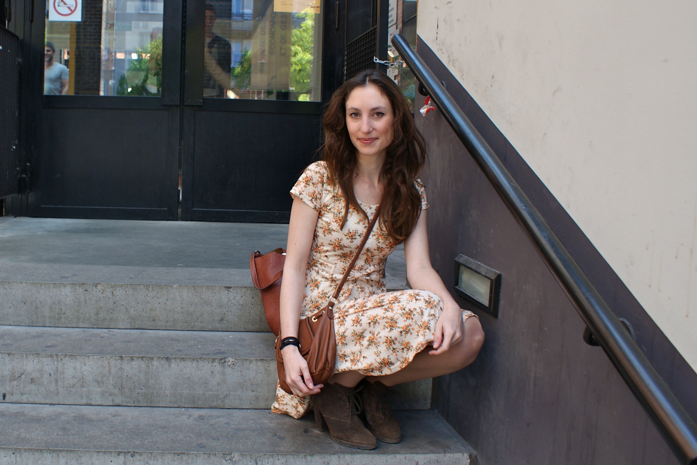 Claire is 22 years old and studies Speech therapy at the Faculty of Health, but is considering changing career.  She is wearing a lovely summer dress with flowers and some cool high heel boots. 