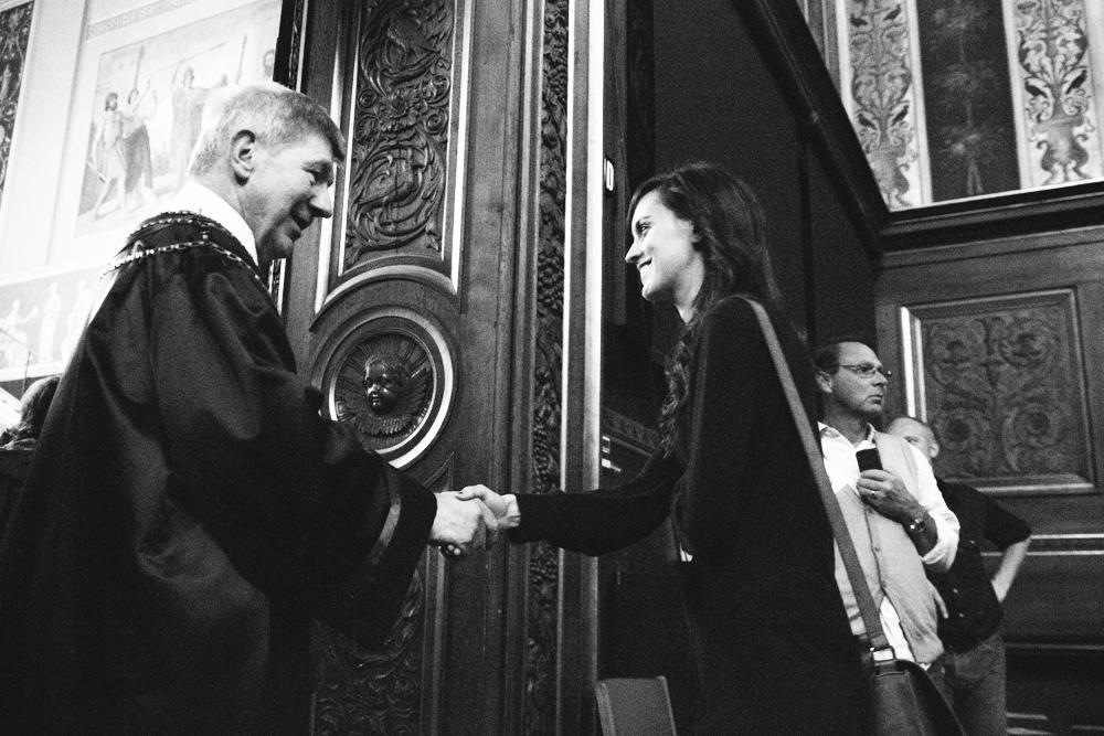 Rector shook hands with hundreds of new students on the way out of the ceremony