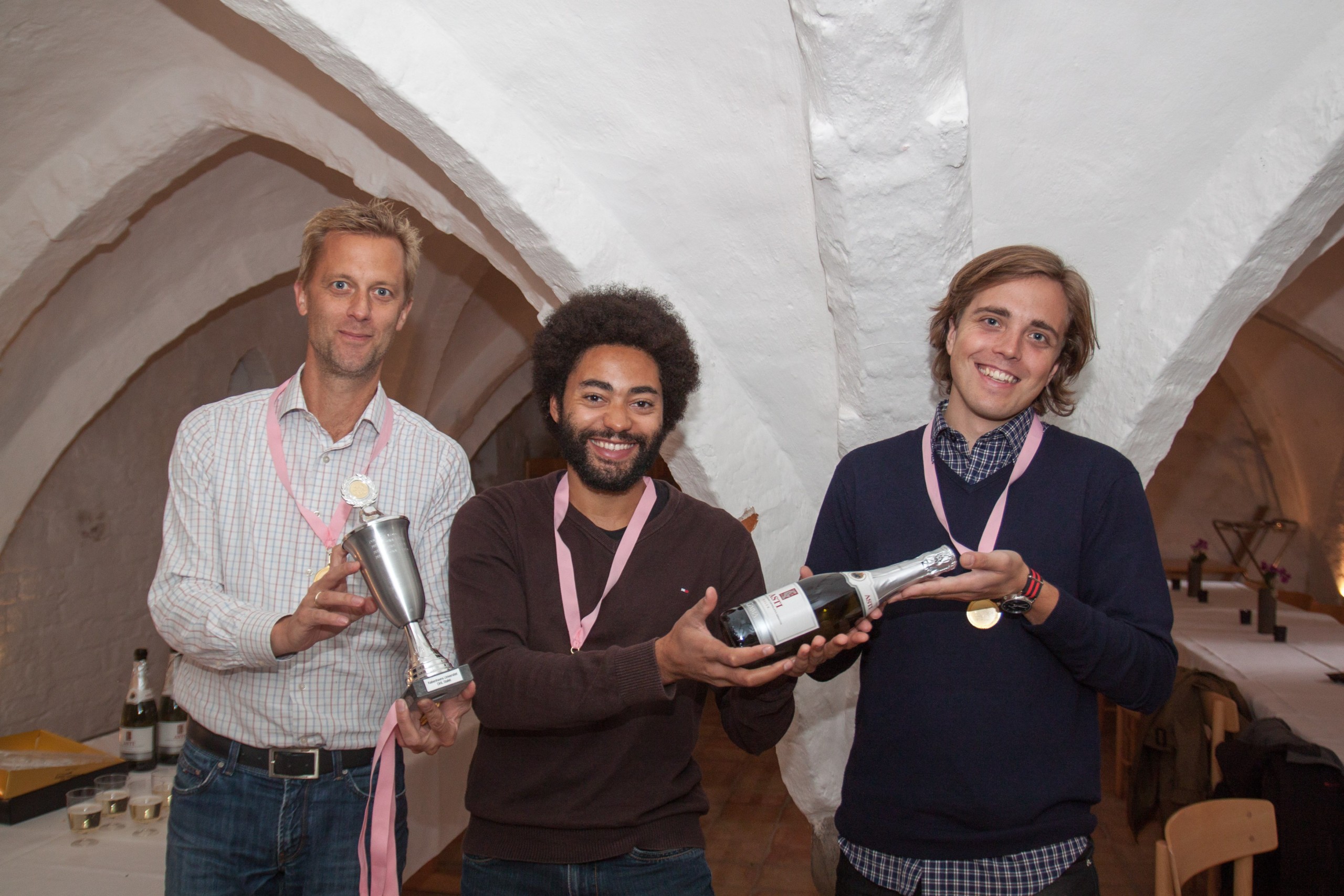 Jonas Eildal, Theis Wilbek and Kristian Strømgaard, from ChemBiol3 team, posing with their spoils of victory. This is the third time in a row they have won the race. 