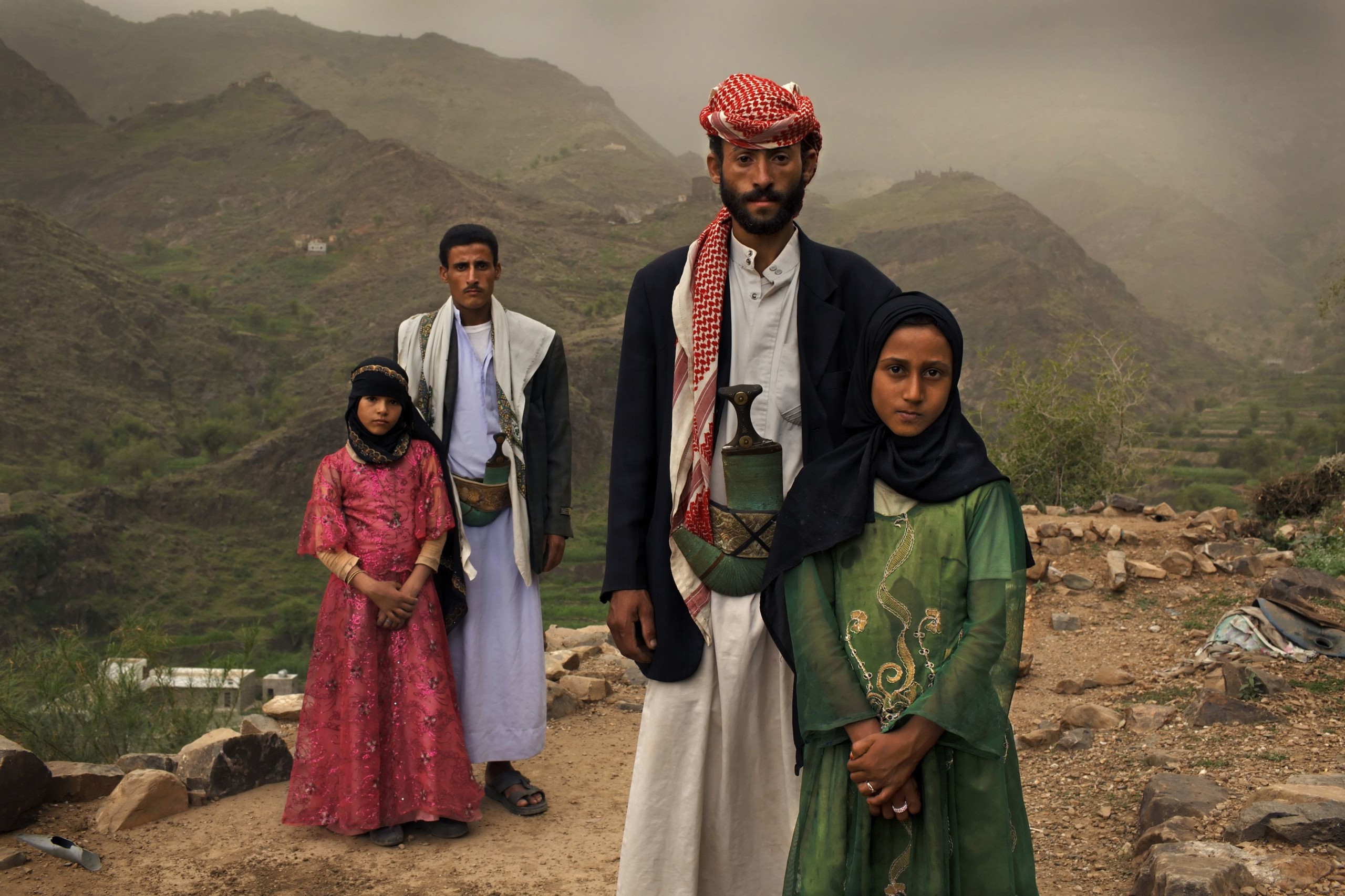 From the photo exhibition 'Too Young to Wed':  ”Whenever I saw him, I hid. I hated to see him,” Tehani (age 8 in pink) recalls of the early days of her marriage to Majed, when she was 6, and he was 25. The young wift posed for a portrait with former classmate Ghada, also a child bride, outside their home in Hajjah, Yemen.
