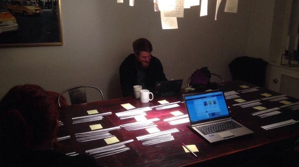 Matching names. A member of the QA programme's staff putting mentors and mentee names together for work groups one late night in December