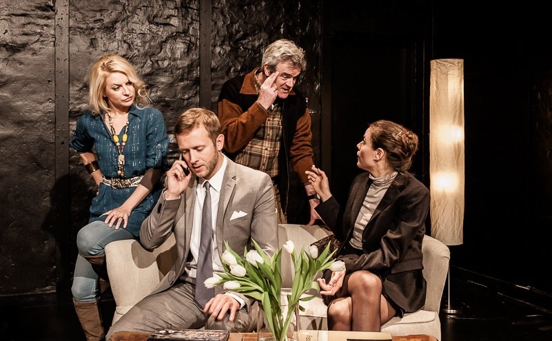 The two couples' polite conversation quickly spirals out of control