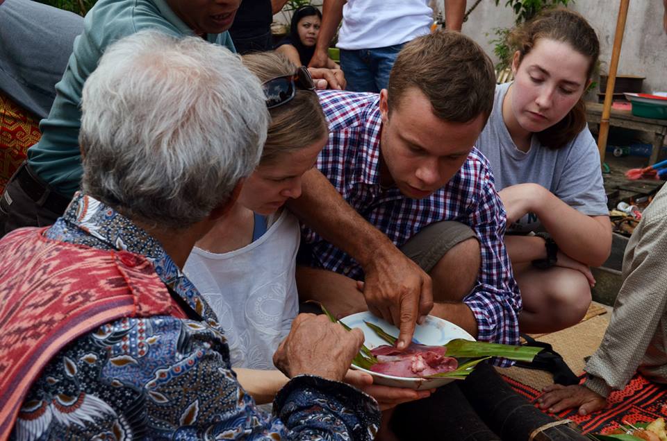 A shaman reads a pig’s liver. Photo credit: Melissa Riman