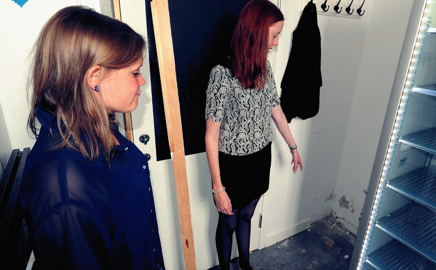 Anne Terp Kristophersen (left) and Solveig Henriksen pointing out the spot where their student café safe was pulled from the wall.