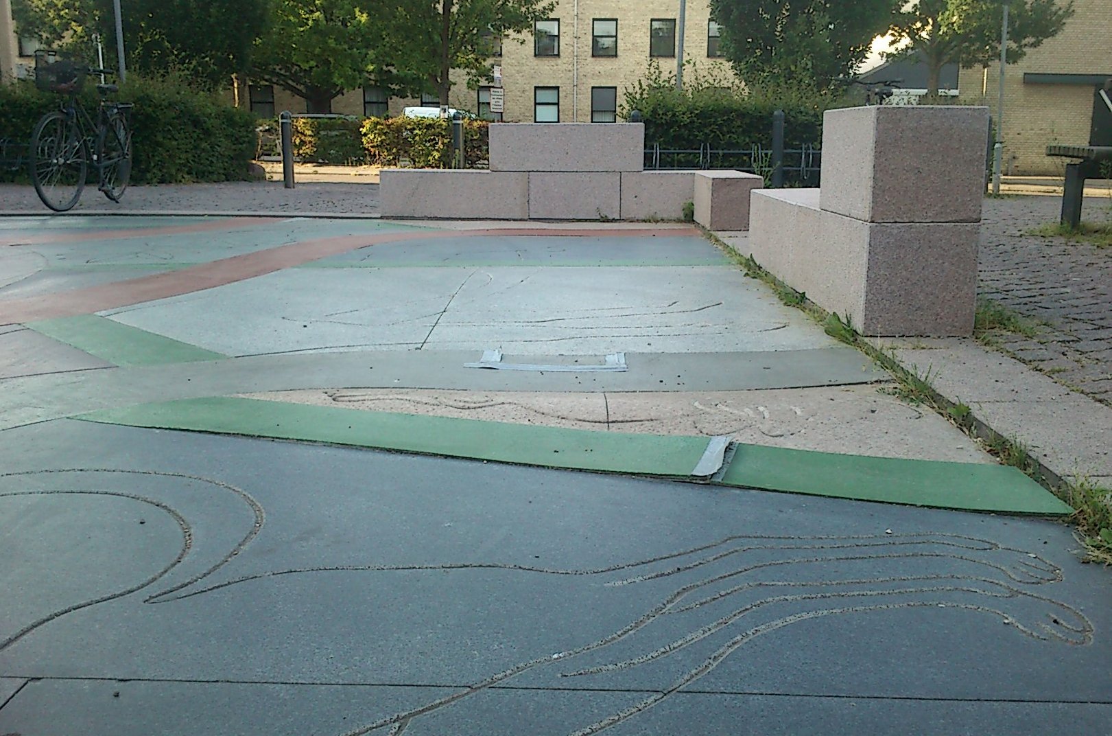 The replacement for the original copper was slabs of concrete-like filler in green, grey and red. They have now cracked, and a temporary solution, duct tape, is holding the work in place