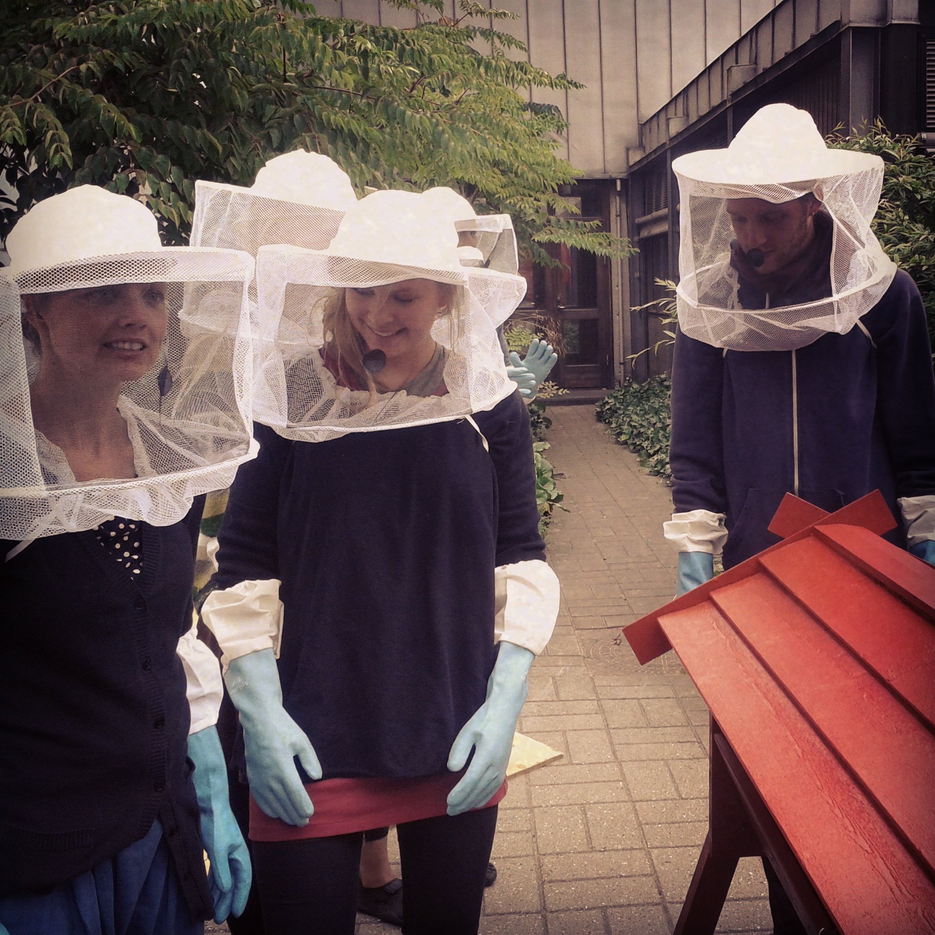 Standard attire for beekeepers. Photo by Tine Engedal