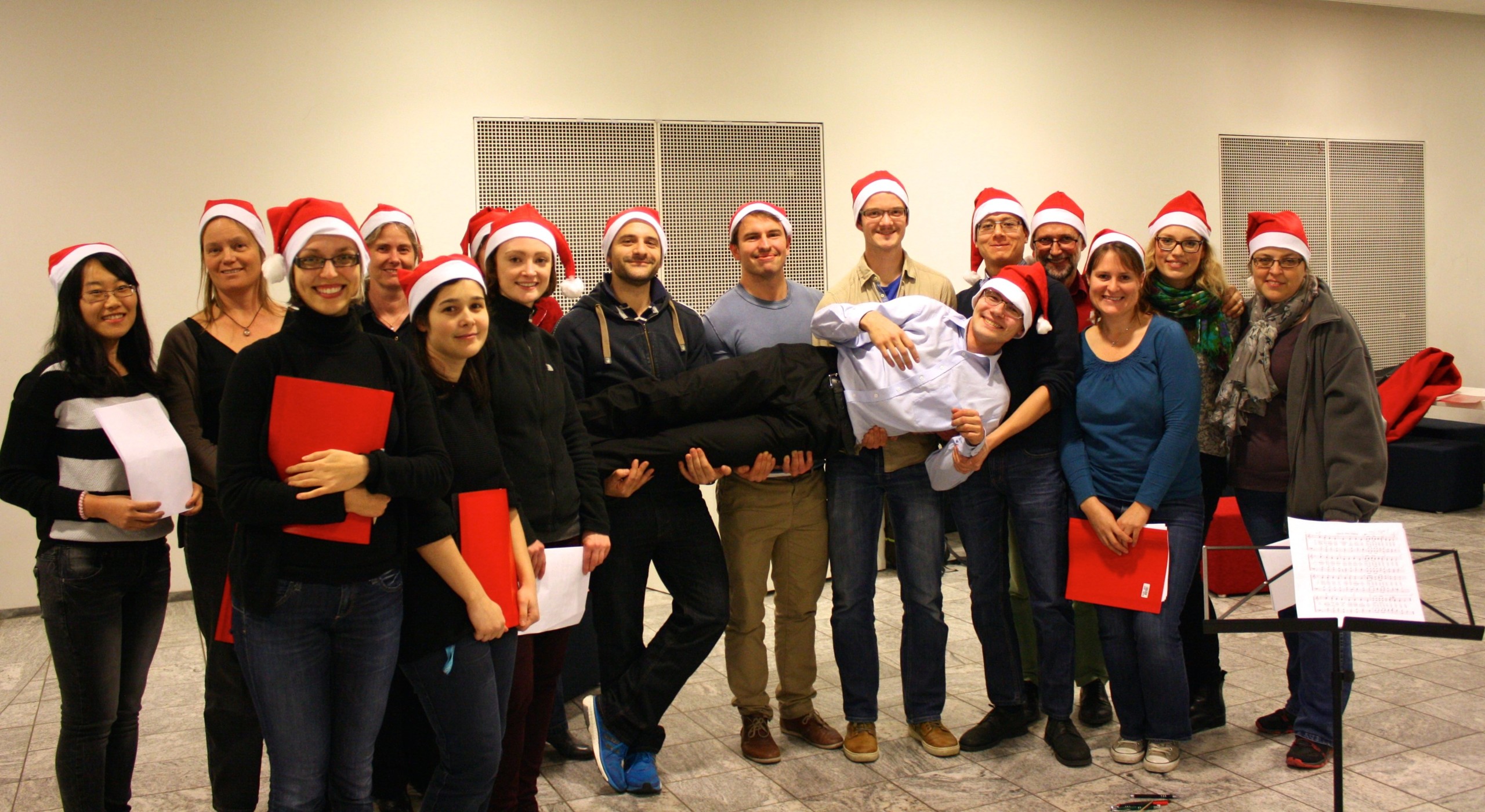 The PLEN Christmas Choir at their last rehersal of the year, holding conductor Dainius
