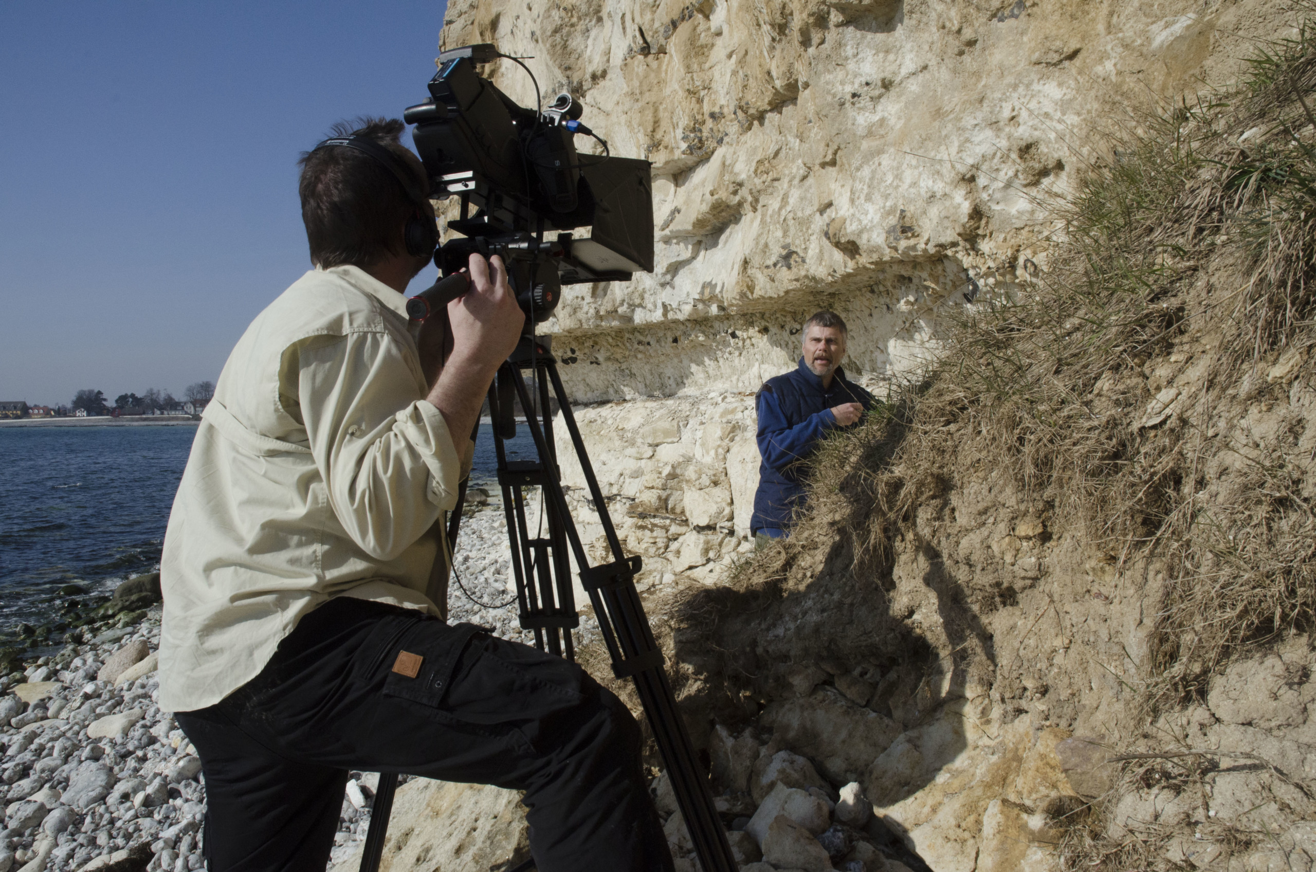 The online lectures are recorded at the museum, in its collections, and outside in the Danish landscape. Here is lecturer Henning Haack at Stevns Klint, a white chalk cliff on the South East coast of Zealand.