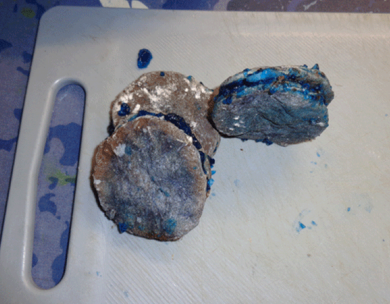 The blue filling is spice-treated bacon to prevent protein oxidation, enmeshed in a meat gelatin