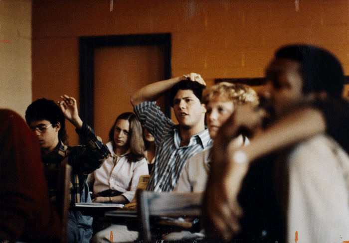 Students in the 1990s engaged in a classroom discussion.