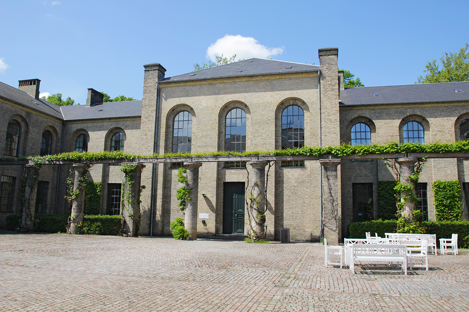 The Landbohøjskolen main building today.  Our photographer couldn't be in the exact location where the original photo was taken above because a newer building now exists there, creating a courtyard enclosed on three sides by the old building and on one side by the newer building.