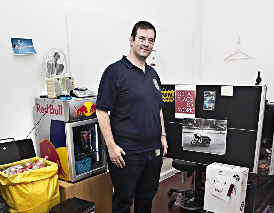 In the IT supporter’s office job satisfaction is as tangible as the empty coke bottles.  On the partition screen he has a picture of the boss who makes his job the best in the world, because she gives him both freedom and responsibility