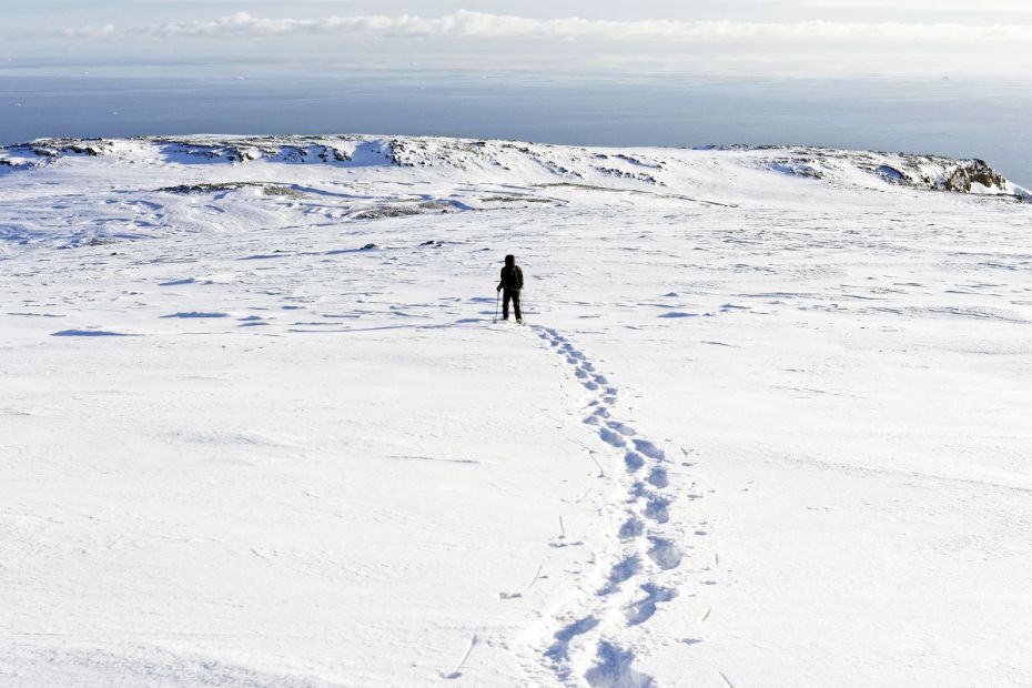 Arctic Station manager Casper T. Christiansen walks at 800 meters altitude with show shoes on Disko Island’s Fjeldmarktoppen summt towards a measuring station that needs to be inspected before winter, a day in late October