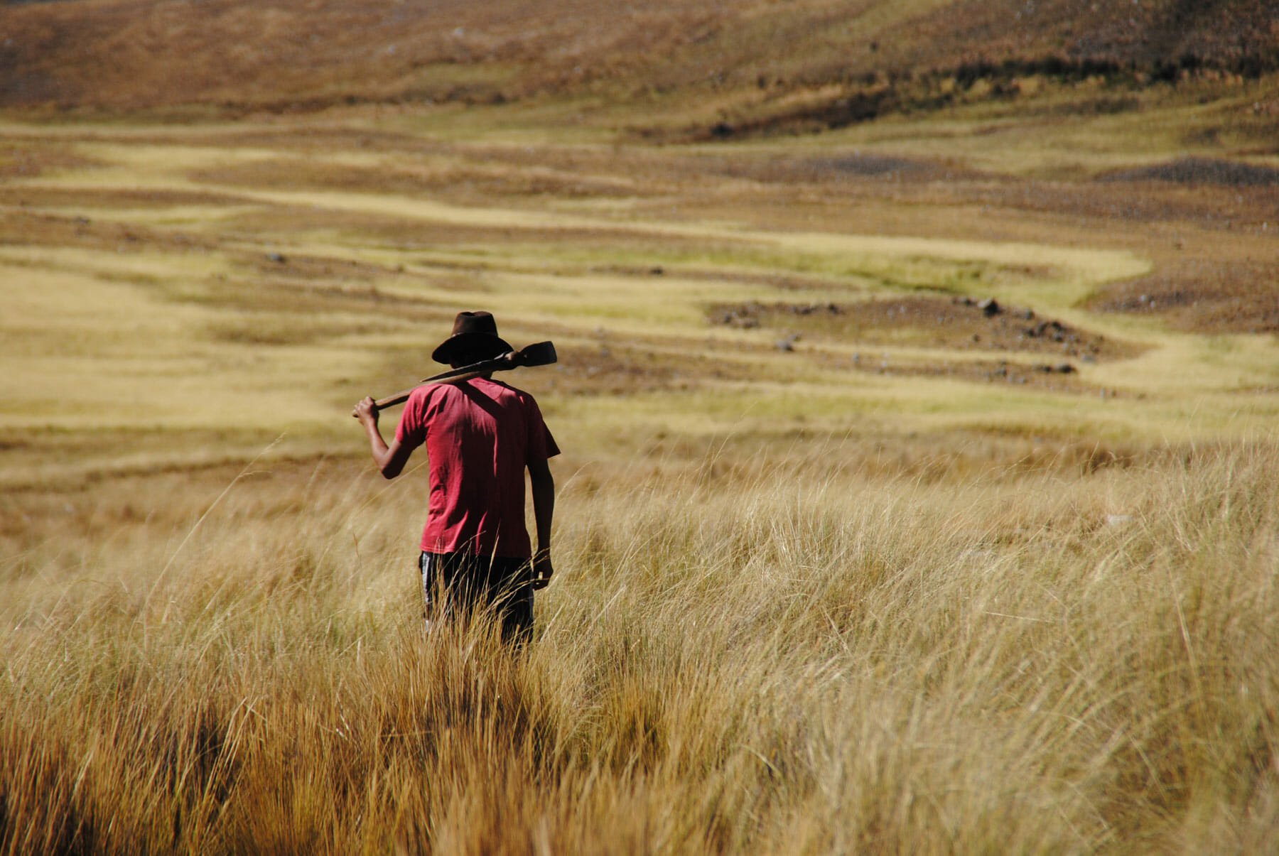 Jhonatan, a 25-year-old Peruvian farmer, is on his way to redirect water toward his own fields.