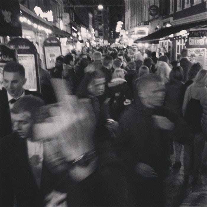 Party people at night in Jomfru Ane Gade, Aalborg.