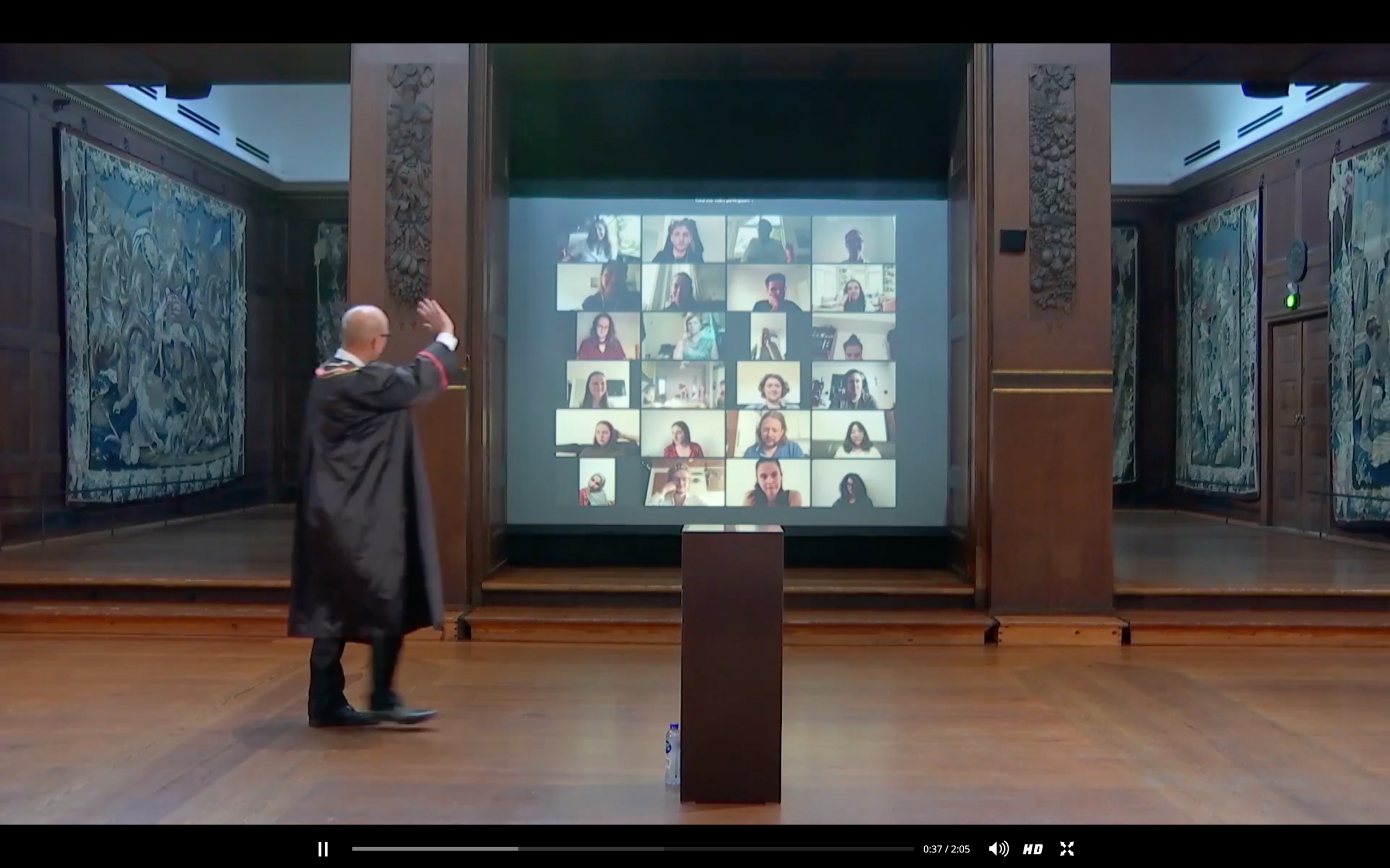 Rector of the University of Copenhagen Henrik C. Wegener waves to a select group of students on Zoom at this year's virtual matriculation ceremony on 21 August. Photo: Screenshot from the university's Facebook page