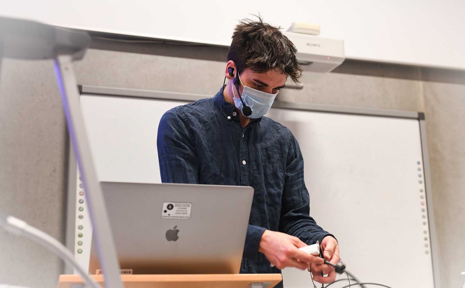 Assistant professor Anders Munk-Nielsen messing around with the tech before an online lecture. 