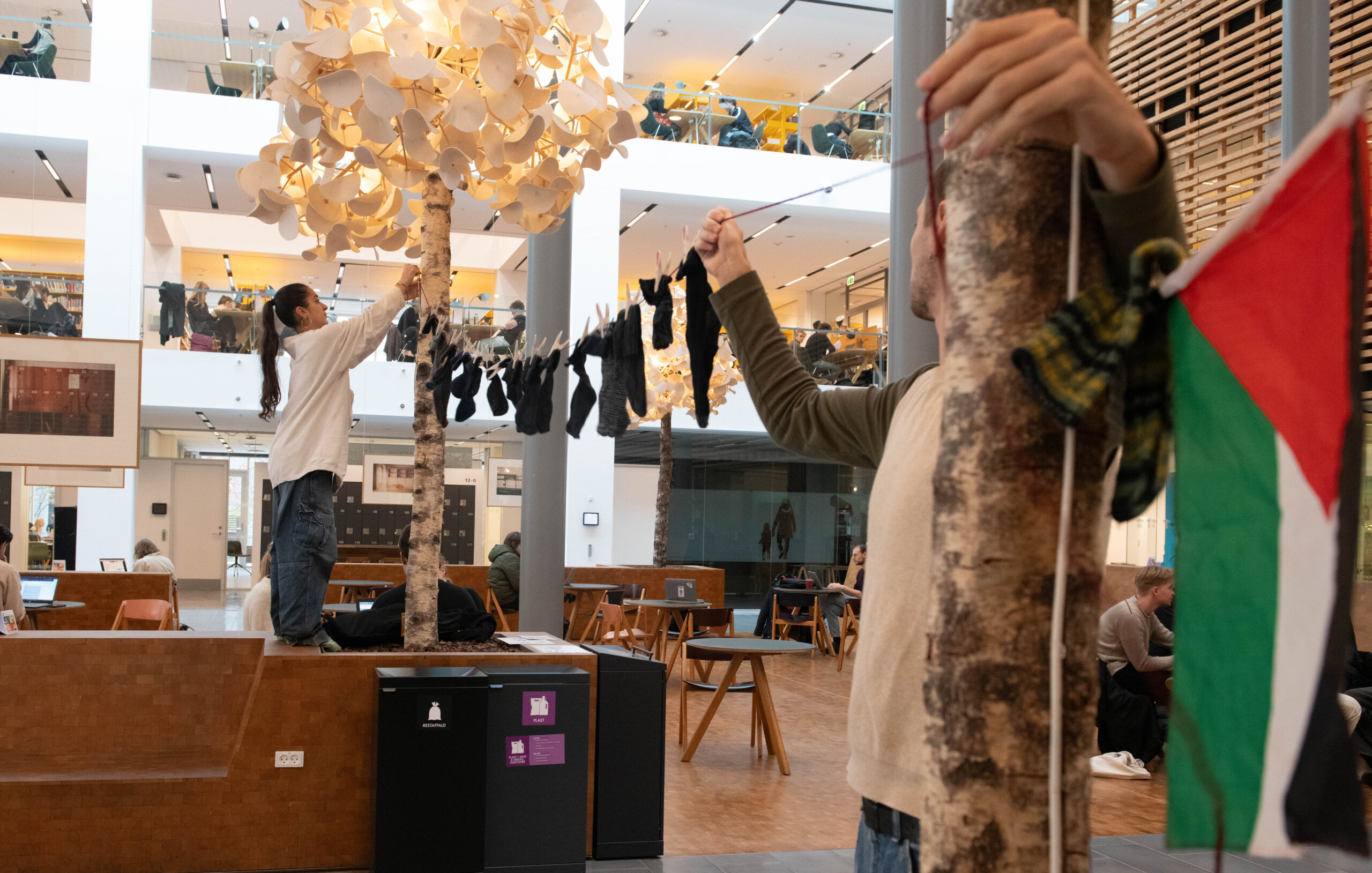Students hang up a chain of socks on South Campus.